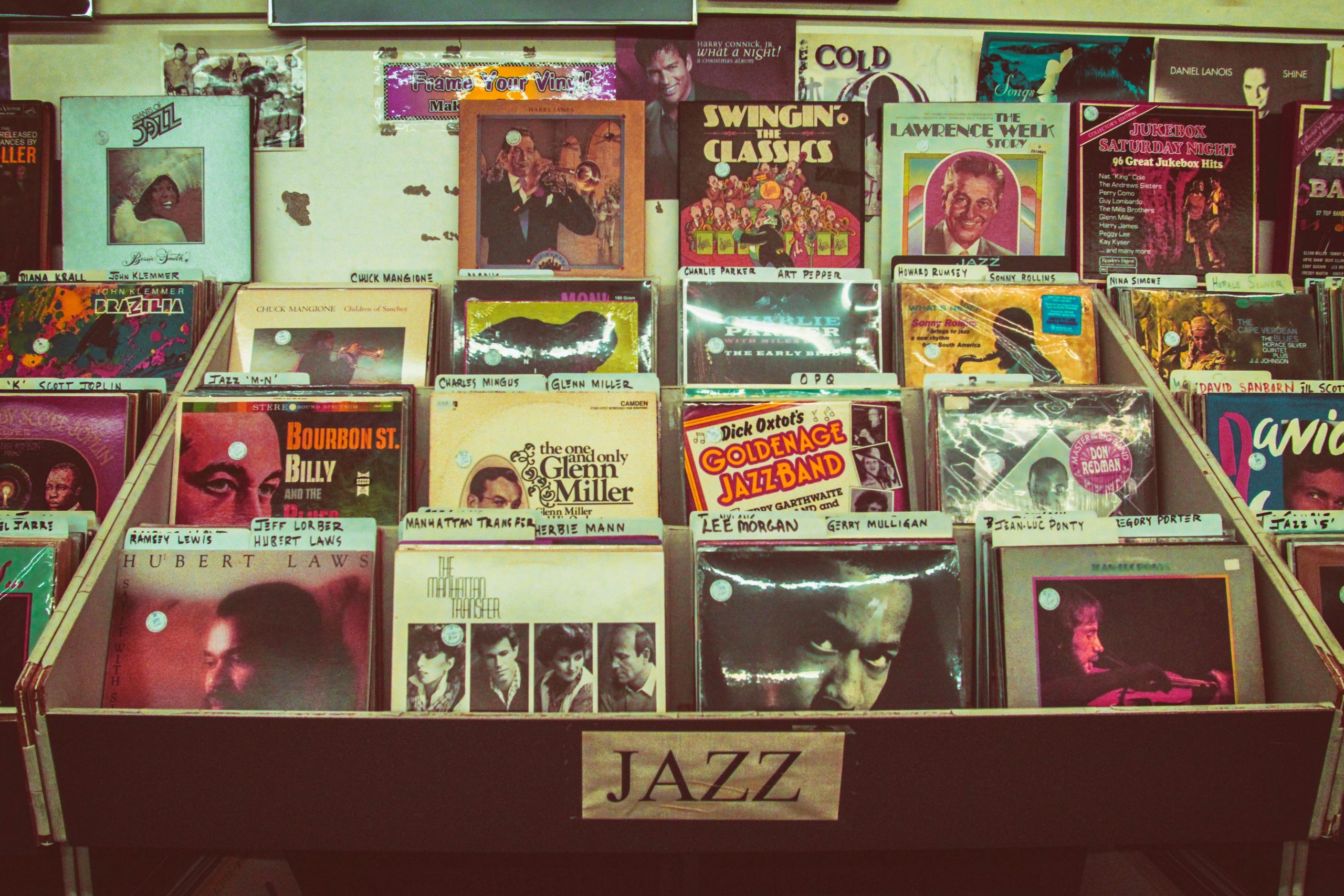 A collection of vintage jazz vinyl records displayed at a music store evoking nostalgia and retro charm.